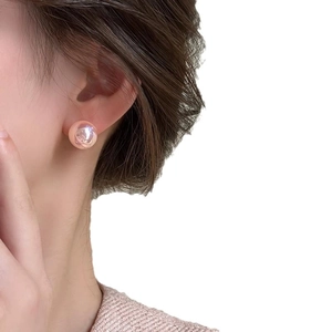 Pink pearl stud earrings for women featuring elegant champagne luster and minimalist design