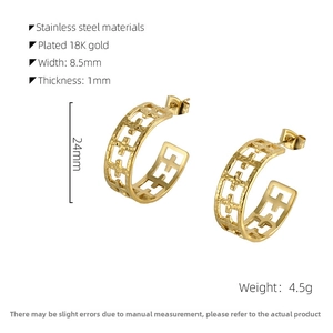 Detail view of 18K gold plated stainless steel C-shaped earrings with geometric grid pattern