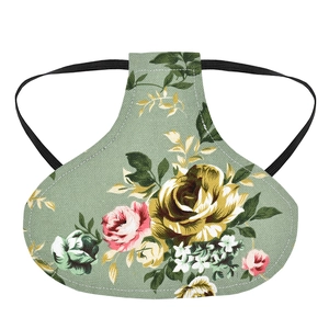Floral print hen saddle with green fabric and elastic straps for poultry protection