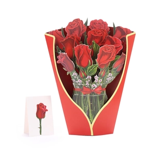 Detail of 3D pop-up greeting card featuring red paper roses in a gold-rimmed sleeve