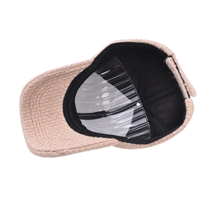 Detailed view of winter baseball cap interior showing warm lining and beige knit texture