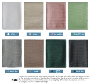 Macro shot of rectangular waffle weave cotton napkins in eight assorted solid colors