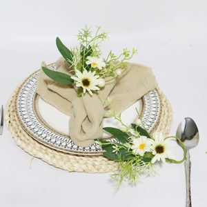 Daisy flower napkin ring with white petals green leaves and pearl accents for table decor