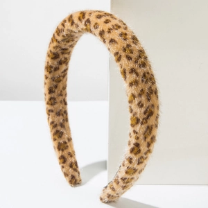 Close-up of a plush leopard print headband with a soft faux fur texture for winter fashion