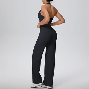 Detail of black sports set with halter neck top and high-waist wide-leg pants