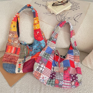 Detail of corduroy patchwork tote bags with floral patterns and drawstring decoration