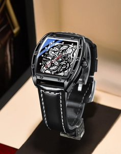 Detailed macro view of black tonneau quartz watch with skeleton dial and leather strap