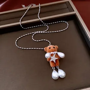 Adjustable brown flocked bear necklace with teardrop pearls and star pendant on silver chain