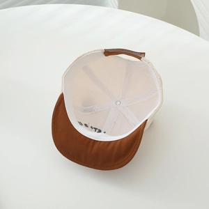 Detail view of cotton baby baseball cap interior showing soft lining and sweatband