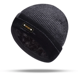Detailed view of the thick fleece lining and knit texture of the winter beanie hat
