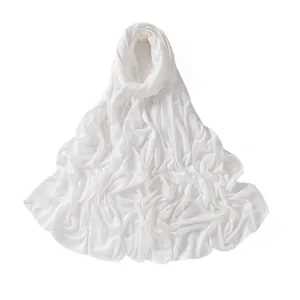 Detail of white mercerized cotton hijab featuring soft jersey texture and neat edge stitching