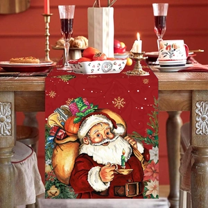 Red Christmas table runner with Santa Claus and snowflakes on a wooden dining table