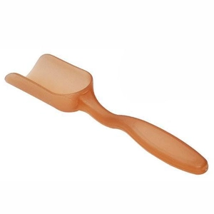 Translucent orange plastic tea scoop with ergonomic handle on a white background