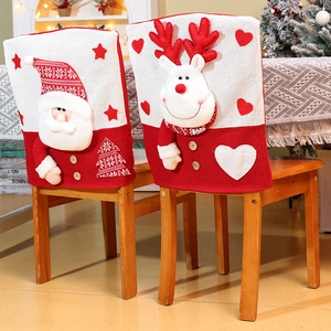 Detail of 3D Santa and Reindeer knitting patterns on red and white Christmas chair covers