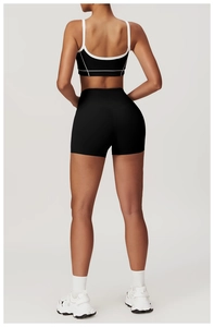 Close-up of black high-waisted sports shorts with seamless contouring and lifting effect