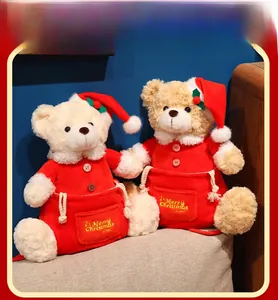 Detail of Christmas teddy bears with Merry Christmas embroidery and red holiday outfits