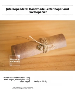 Detail of vintage kraft paper letter set with metal anchor charm and hemp rope tie