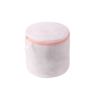 Cylindrical mesh laundry bag with pink zipper for protecting delicate bras and lingerie