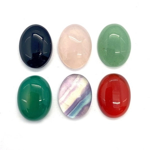 Macro shot of six assorted 12x16mm oval natural stone cabochons for DIY jewelry