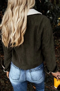 Rear view of dark green corduroy jacket with plush white lamb wool collar and rib texture