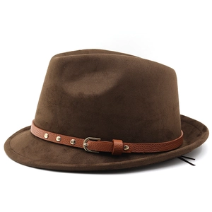 Close-up of brown suede fedora featuring leather band with gold rivets and buckle detail