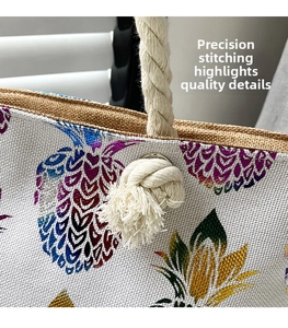 Close-up detail of reinforced stitching and white cotton rope handles on tote bag