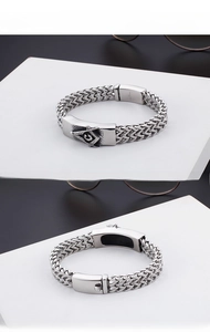 Macro shot of stainless steel Freemason bracelet featuring double-row braided chain and clasp