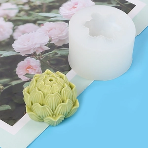 Detail view of white silicone mold and a green 3D peony flower soap candle craft