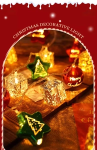 Detail of Christmas LED string lights with star, gift box, and Merry Christmas ornaments
