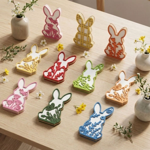 Detail view of 10-piece 3D floral pattern bunny Easter ornaments on a wooden table