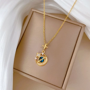 Elegant gold celestial necklace with blue gem planet, sparkling moon and star pendant