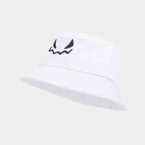 Detailed close-up of white cotton bucket hat with black ghost face embroidery
