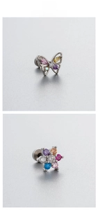 Detailed macro view of butterfly and floral titanium steel stud earrings with colorful zircons