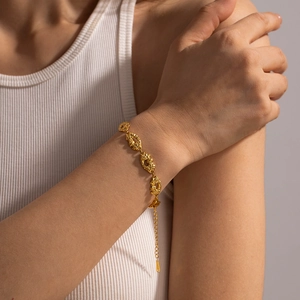 Textured 18K gold plated stainless steel bracelet with hammered oval links and chain