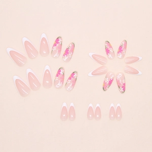 White French tip and pink floral press on nails with small bow details in almond shape
