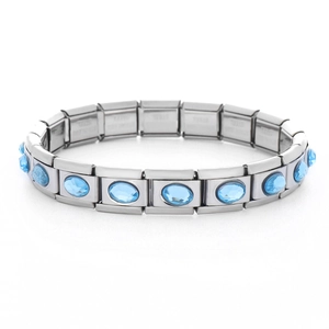 Detailed close-up of a stainless steel stretch bracelet featuring oval blue gemstones