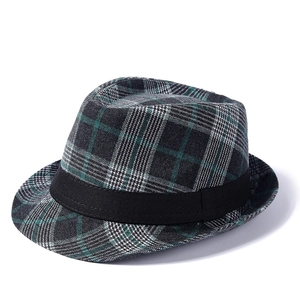 Classic British style fedora hat with green and grey plaid pattern on white background