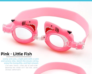 Close-up of pink kids swim goggles with cute shark decoration and anti-slip silicone strap