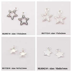 Detailed view of four silver star pendants including hollow and solid alloy charms