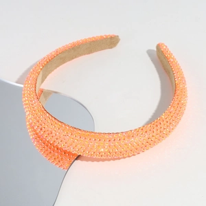 Detailed view of rhinestone headband with coral sequins and soft velvet lining