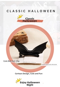 Detail of bat-shaped leather hair clip with a black satin bow and silver alligator clip