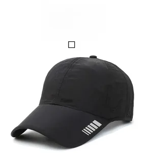 Detail of black breathable baseball cap with reflective silver stripes on the brim