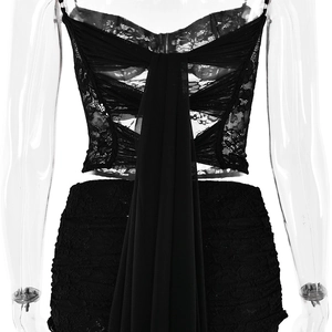 Detail view of lace corset top back with sheer see-through floral patterns and long ribbons