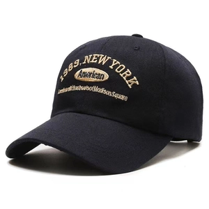Close-up of 1989 New York embroidery on navy blue cotton twill baseball cap
