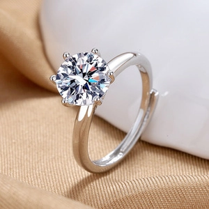 Macro shot of silver classic six-prong crown setting ring with large round solitaire gem