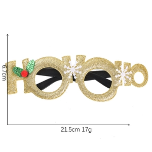 Detailed specs of gold glitter HO HO HO Christmas party glasses with holly leaves