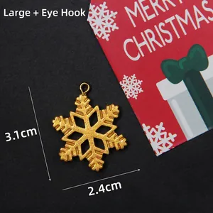 Detailed view of large gold glitter snowflake pendant with eyelet, 3.1cm x 2.4cm