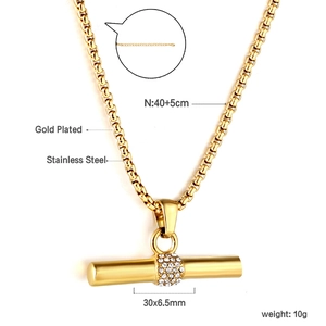 Gold-plated stainless steel cylinder necklace with sparkling crystals and chain details