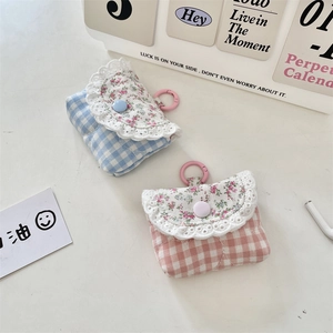 Lace-trimmed plaid earbud case covers in pink and blue with a sweet floral flap