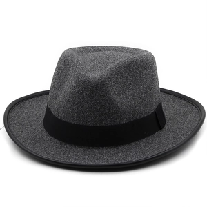 Detail of dark grey wool felt cowboy hat with black ribbon and reinforced hemmed brim